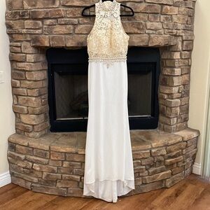 NWOT exquisite high-low dress with diamond like and pearl embellishments. Large